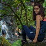 Me sitting on a rock in fronyt of Oahu waterfall